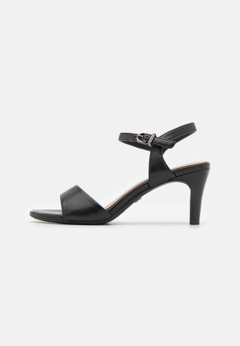 Black leather high-heeled sandal with a smooth texture, open toe, wide strap across foot, an adjustable ankle strap, and a slender heel.