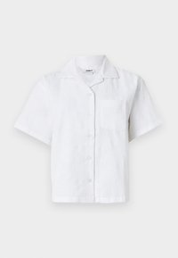 Short-sleeve white shirt featuring a textured pattern, button front, and chest pocket. Made from lightweight fabric with a relaxed fit.