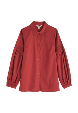 Red button-up shirt with long, puffed sleeves featuring smocked details at the cuffs. Smooth texture and a classic collar design.