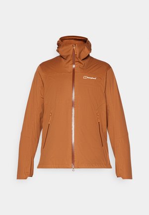 Jachetă maro cu fermoar, cu glugă, având două buzunare laterale, un material texturat și fermoar și accente portocalii în contrast. Logo-ul este afișat pe piept.