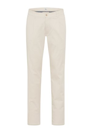 Pantaloni beige aderenti con chiusura a bottoni e zip, tasche laterali e foderatura decorativa interna in vita.