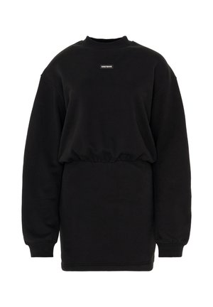 Black sweatshirt dress with a rounded neckline, long sleeves, cinched waist, and small logo patch on the front. Soft texture, casual fit.