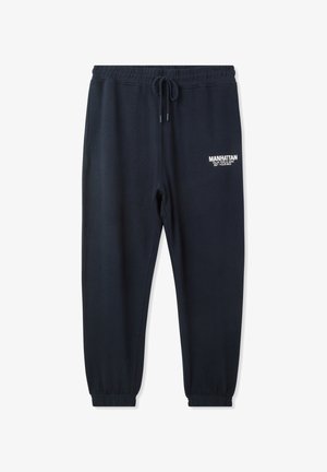 Pantaloni della tuta blu navy con vita elastica, cordoncino e caviglie elasticizzate. Presentano dettagli testuali bianchi sul lato sinistro. Tessuto morbido.