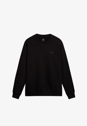 Sudadera negra hecha de felpa de algodón, con un cuello redondo, mangas largas y un logo sutil en relieve en el pecho.