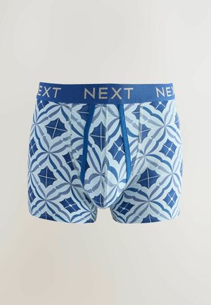 Blå mönstrade kalsonger med geometrisk design, elastisk midja med "NEXT"-logotyp och mjukt bomullsmaterial.