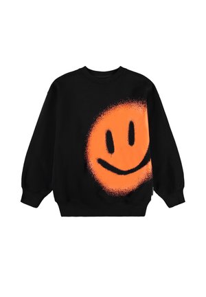 Must musta, millel on suures vormis oranž spray-keraamiaga naeratav nägu. Omab soonikuid varruka- ja allääres, valmistatud pehmest kangast.