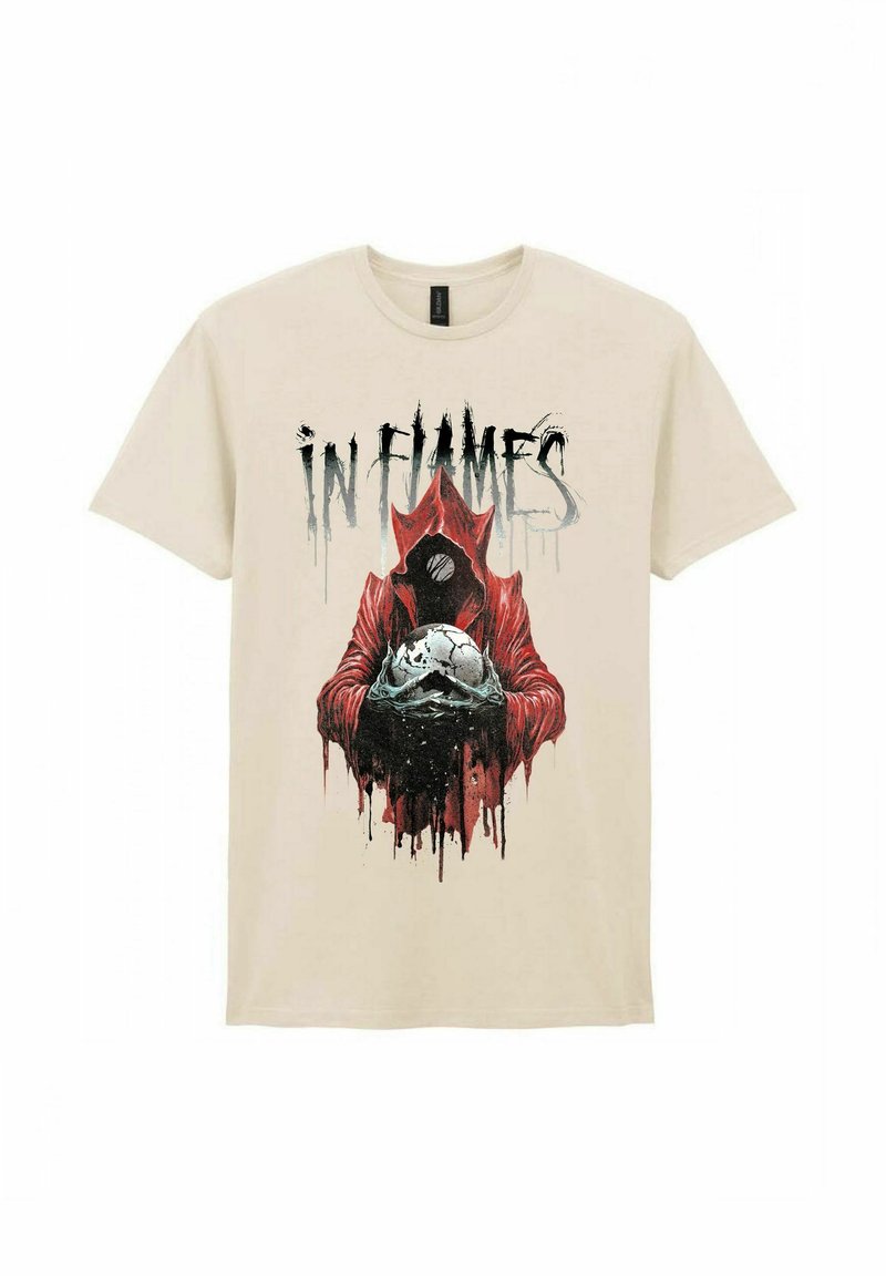 Beige cotton t-shirt featuring a black and red graphic of a cloaked figure holding a skull with white accents, and the text "IN FLAMES" above.