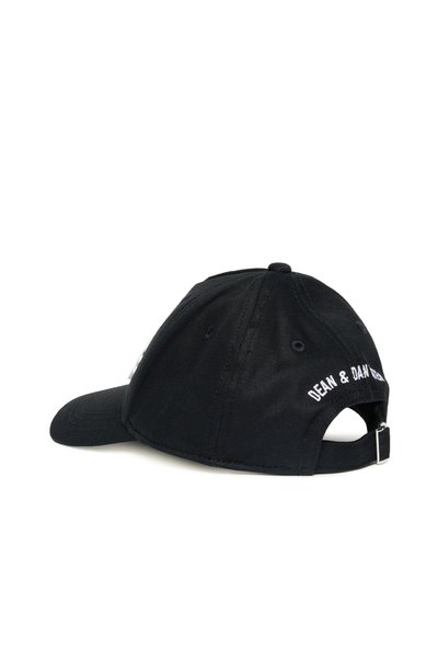 Black baseball cap made of fabric, featuring a curved visor, adjustable strap, and white embroidered "DEAN & DAN" logo on the back.
