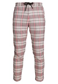 Rutiga byxor med elastiskt midjeband och dragsko. Har ett grått, rött och svart rutigt mönster. Mjuk tygkvalitet, smal ben design.