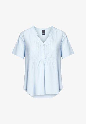 Heledsinine lühikeste varrukatega topp V-kaelusega, millel on esiplekid ja nupuga kinnitamine. Pehme kangas, lõdva lõikega ja kõveraläänega.