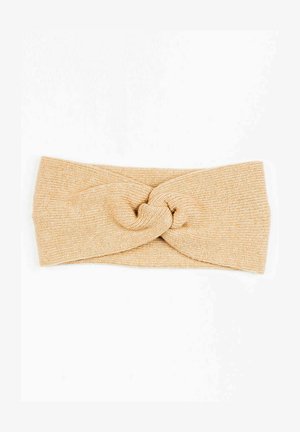 Geknoopte hoofdband gemaakt van zachte, gestructureerde breisel in lichtbeige. Beschikt over een gedraaide stijl aan de voorkant met een gelijke breedte rondom.