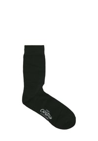 Knielange zwarte sokken met een verstevigde boord en een gladde textuur; voorzien van witte tekst "Vrolijk Kerstfeest" en een logo aan de zijkant.