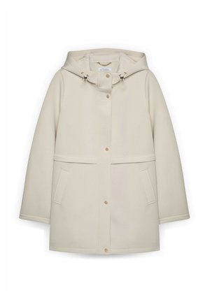 Licht crèmekleurige gewatteerde jas met capuchon, gemaakt van glad, waterbestendig materiaal. Voorzien van drukknopen, voorzakken en verstelbare trekkoorden op de capuchon.