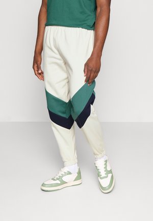 PANTALON CHANDAL RETRO ATHLETIC UNISEX - Tracksuit bottoms - marfil/heura/navy