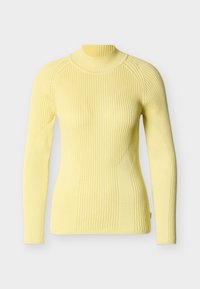 Κίτρινο ριμπ πλεκτό πουλόβερ με μακριά μανίκια και ζιβάγκο, με εφαρμοστή γραμμή και υφασμάτινη πλέξη με διακριτικές ραφές. Απαλή υφή.