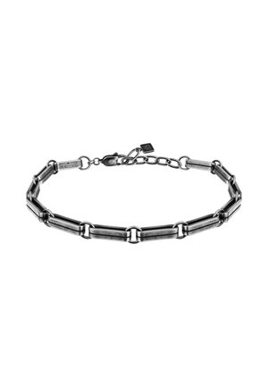 Bracciale in metallo con collegamenti allungati e finitura nera opaca. Include una chiusura a artiglio e catena regolabile per la misura.