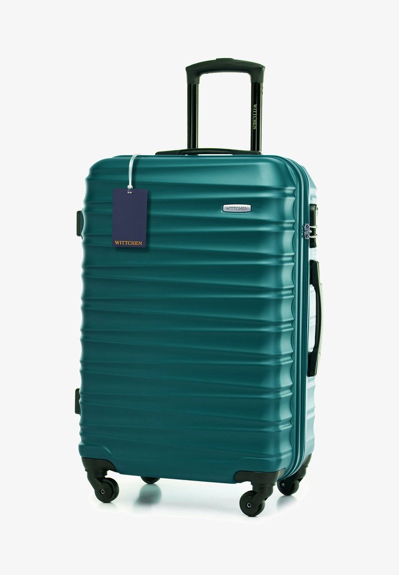 Tvrdý kufr v tyrkysové barvě s žebrovanou texturou, teleskopickou rukojetí, čtyřmi kolečky a visačkou s nápisem "WITTCHEN". Obsahuje kontrastní černé kovové prvky.