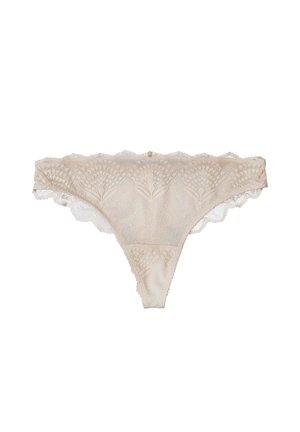 Schnürslip in Nude-Farbe mit floralem Muster, gewellten Kanten und einer Mittelnaht, sowie einem kleinen dekorativen Akzent am Bund.