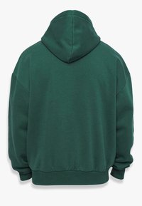 Groene katoenen hoodie met een ruime pasvorm, voorzien van een capuchon, ribgebreide manchetten en een elastische zoom. Gladde textuur met minimale naden.