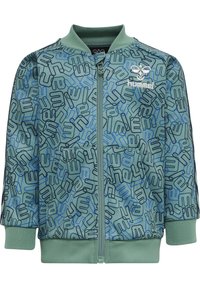 Grön zip-up jacka med ett upprepande mönster av blå och svarta designer, med ribbade muddar och krage, tillverkad av slät tyg.