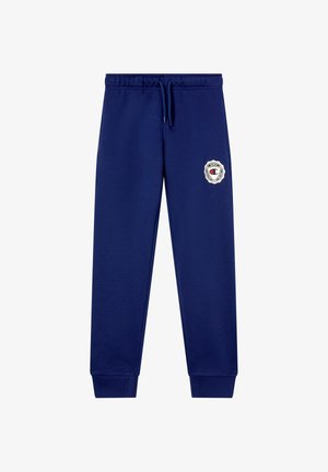 Pantalones de chándal azul marino hechos de tela suave, con una cinturilla elástica y cordón, y un logo en el muslo.