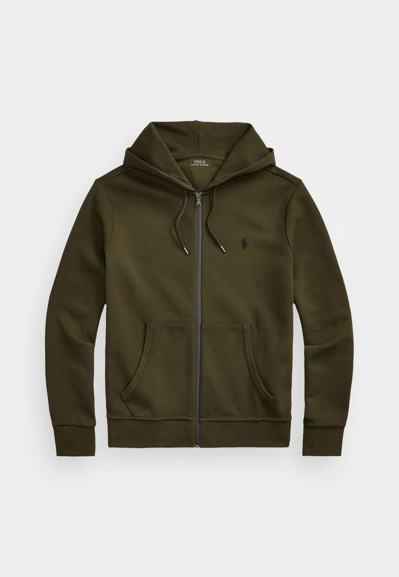 Oliwkowy sweatshirt z zamkiem błyskawicznym, z kapturem na sznurki, przednimi kieszeniami oraz małym logo na lewej piersi. Miękki materiał i ściągacze przy mankietach.