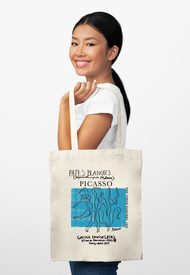 Borsa a spalla in tela color crema con opere d'arte di Picasso raffiguranti figure astratte blu. Il testo include "PATES BLANCHES" e "GALERIE LOUISE LEIRIS."
