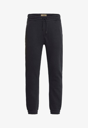 Zwarte sweatpants met een elastische tailleband, trekkoord, zijzakken, taps toelopende pijpen en geribbelde boorden. Gemaakt van zachte, ademende stof.