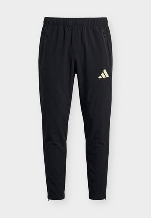 adidas Performance, TIRO TRAVEL PANTS - Jogginghose - black/warm vanilla
