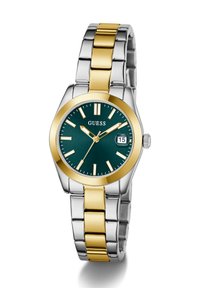 Montre en métal doré et argenté avec un cadran rond vert, des accents dorés, un affichage de date et un bracelet en maillons argentés. Présente des marqueurs d'heure en gras.