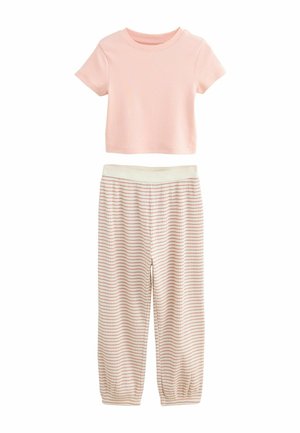 Top rosa a maniche corte abbinato a pantaloni da pigiama a scacchi con vita elasticizzata in crema e rosso. Il tessuto è morbido, leggero e traspirante.