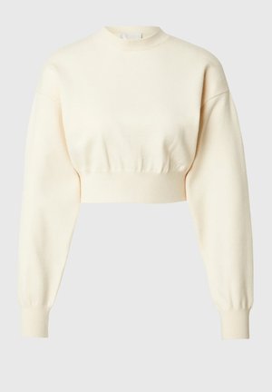 Gekürzter cremefarbener Pullover mit langen, puffigen Ärmeln und hohem Kragen. Besitzt einen strukturierten Strickstoff und gerippte Bündchen für eine enganliegende Passform.