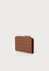 Brown leather wallet with embossed pattern, zipper closure, slim profile, and smooth texture. Compact design suitable for cards and cash.