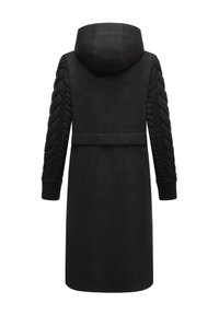 Black coat with a hood, featuring cable-knit sleeves. Soft texture and long design with a belted waist, emphasizing warmth and comfort.