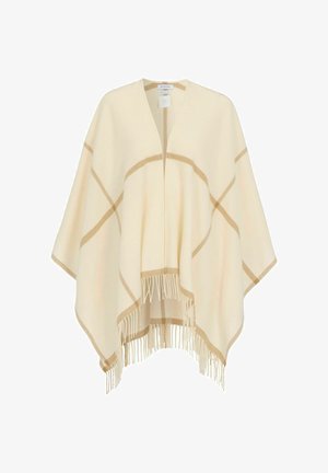 Kremfarvet poncho med åbent forstykke, lys brun ternet mønster og frynsekant langs bundkanten.