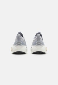 Gray athletic shoes with a mesh upper, textured fabric accents, and a white sole featuring a black tread pattern. Logo on heel.