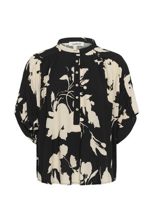 Blusa floral en blanco y negro con mangas cortas abullonadas, cuello mandarín y tapeta de botones en el centro delantero.