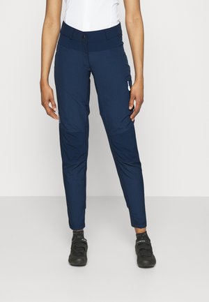 Navy blue, lightweight, tapered pants with a wide waistband, two side pockets, and a cargo pocket with a zipper detail on the thigh.