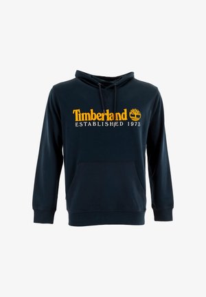 Marineblauwe hoodie van zacht materiaal, met een kangoeroezak, een capuchon met trekkoord en een gele Timberland-logo met "OPGERICHT 1973."