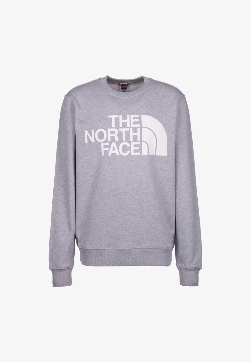 Jasnoszara bluza z okrągłym dekoltem i długimi rękawami, z dużym białym logo "THE NORTH FACE" i wzorem łuku na przodzie.