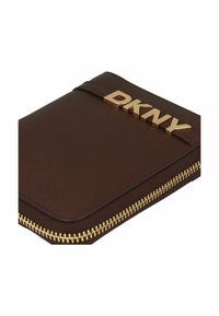 Brown zippered wallet made from textured material, featuring a gold DKNY logo and a gold zipper accent, with a rectangular shape.