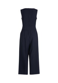 Combinaison bleu marine à bretelles, avec un pantalon large, une taille ajustée et une fermeture éclair dissimulée dans le dos. Texture de tissu lisse.