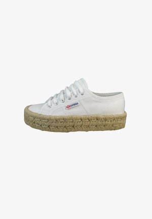 White canvas Superga sneaker with lace-up closure and thick braided jute platform sole against plain background.