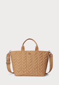 Tan quilted tote bag with a chevron pattern, top handles, and an adjustable strap featuring embossed branding. Durable material with subtle sheen.