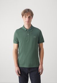 Lacoste Pólóing - vert fonce