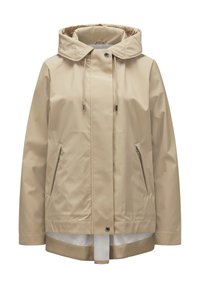 Beige wasserdichte Jacke mit Kapuze, Kordelzug, Seitentaschen und glatter Textur. Verfügt über ein kontrastierendes Innenfutter.