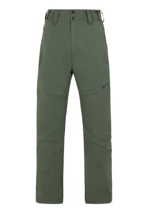Pantalones verdes, impermeables, con un corte relajado, bolsillos con cremallera y rodillas reforzadas. Incluye un dobladillo con cremallera para facilitar su uso sobre botas.
