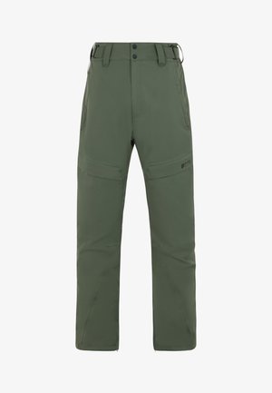 Pantalons verts imperméables avec une coupe décontractée, poches zippées et genoux renforcés. Dotés d'un ourlet zippé pour un enfilage facile par-dessus des bottes.