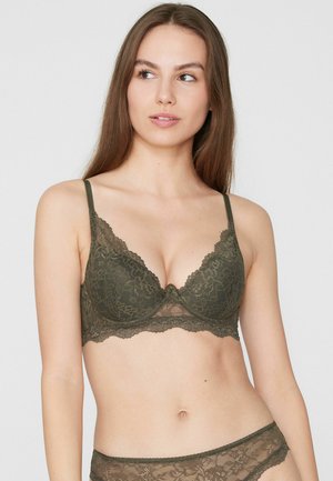 Reggiseno in pizzo verde oliva scuro, caratterizzato da un motivo floreale, spalline regolabili e un design con bordo smerlato. Dettagli in mesh alla base.
