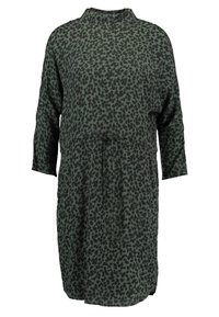 Grön klänning med svart leopardmönster, hög hals och trekvartslånga ärmar. Har en dragsko i midjan för justerbar passform. Mjuk textur.